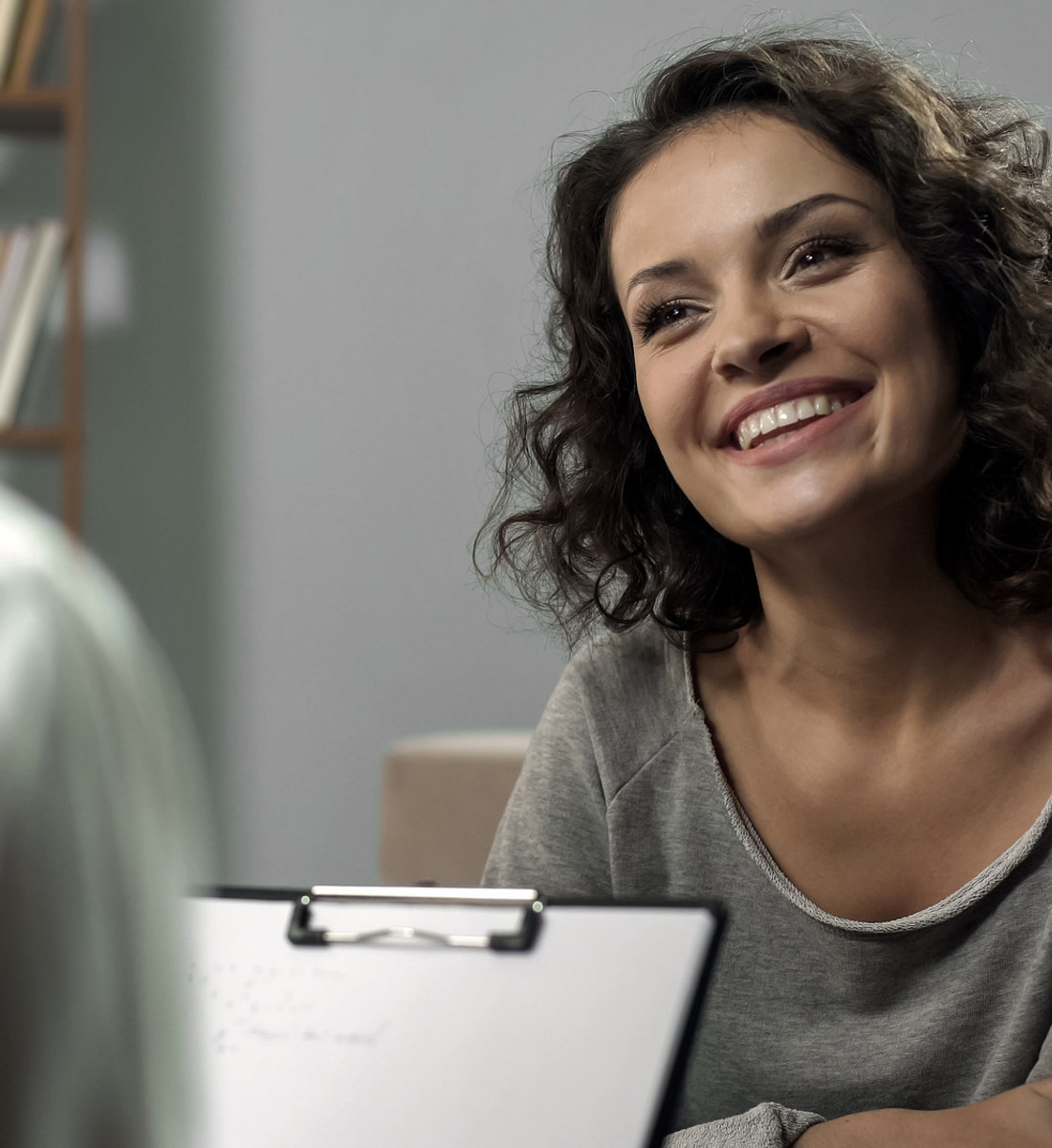 A patient smiling during a visit
